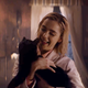 Sabrina (Kiernan Shipka) meets her new feline friend.